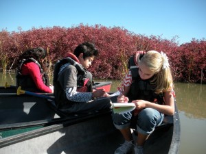 students writing in canoe